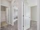 Bright hallway with carpet flooring and access to bedrooms and bathroom at 222 Kylemore Cir, Cary, NC 27513