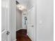 Clean and simple hallway with hardwood floors and neutral walls at 222 Kylemore Cir, Cary, NC 27513