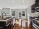 Bright kitchen with hardwood floors and access to backyard at 222 Kylemore Cir, Cary, NC 27513