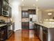 Modern kitchen with stainless steel appliances and granite countertops at 222 Kylemore Cir, Cary, NC 27513