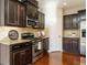 Kitchen features stainless steel appliances and granite countertops at 222 Kylemore Cir, Cary, NC 27513