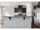Kitchen island with granite countertop and breakfast bar at 222 Kylemore Cir, Cary, NC 27513
