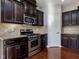 Modern kitchen with stainless steel appliances and granite countertops at 222 Kylemore Cir, Cary, NC 27513