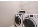 Laundry room with washer, dryer and shelving at 222 Kylemore Cir, Cary, NC 27513
