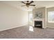 Spacious living room featuring a cozy fireplace and large windows at 222 Kylemore Cir, Cary, NC 27513