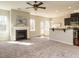 Living room with fireplace and view into kitchen area at 222 Kylemore Cir, Cary, NC 27513