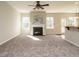 Bright living room with fireplace, hardwood floors and access to kitchen at 222 Kylemore Cir, Cary, NC 27513