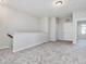 Loft area with carpet and doors to bedrooms at 222 Kylemore Cir, Cary, NC 27513
