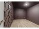 Basement bonus room with unique geometric wall design and LVP flooring at 2421 New Bern Ave, Raleigh, NC 27610