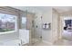 Elegant bathroom with glass shower and garden views at 2613 Stonington Dr, Cary, NC 27523