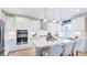 Modern kitchen with white cabinets, stainless steel appliances, and an island at 2613 Stonington Dr, Cary, NC 27523