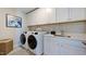 Convenient laundry room with washer, dryer, and cabinets at 2613 Stonington Dr, Cary, NC 27523
