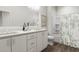 Bright bathroom featuring a double sink vanity, large mirror, and shower/bath combo at 3021 White Rail Dr, Fuquay Varina, NC 27526