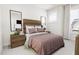 Cozy bedroom features wood details, a large window and comfortable furnishings at 3021 White Rail Dr, Fuquay Varina, NC 27526