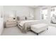 Bright bedroom with a large window, upholstered headboard, and neutral-toned bedding and furniture at 3021 White Rail Dr, Fuquay Varina, NC 27526