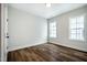 Bright bedroom featuring hardwood floors and large windows at 306 Quarter Gate Trce, Chapel Hill, NC 27516