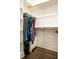 Walk-in closet with shelves and hanging rods at 306 Quarter Gate Trce, Chapel Hill, NC 27516