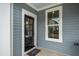 Exterior front door with welcome mat and sidelight window at 306 Quarter Gate Trce, Chapel Hill, NC 27516