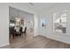 Bright dining room with glass table and chairs, open to kitchen at 3200 Retama, New Hill, NC 27562