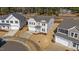 Two-story house in a residential neighborhood with gray siding and a two-car garage at 34 Windflower Ct, Clayton, NC 27520