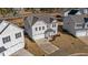 Two-story house in a neighborhood, featuring gray siding and a two-car garage at 34 Windflower Ct, Clayton, NC 27520
