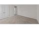 Bedroom with double doors and carpet flooring at 34 Windflower Ct, Clayton, NC 27520