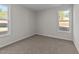 Simple bedroom with neutral walls and carpet flooring at 34 Windflower Ct, Clayton, NC 27520