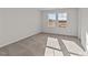 Bright bedroom with neutral walls and carpet at 34 Windflower Ct, Clayton, NC 27520