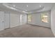 Primary bedroom featuring recessed lighting, tray ceilings, and neutral carpet flooring at 34 Windflower Ct, Clayton, NC 27520