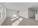 Large bonus room with carpet, windows, and access to a hallway at 34 Windflower Ct, Clayton, NC 27520