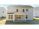 Two story house with covered patio at 34 Windflower Ct, Clayton, NC 27520