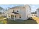 Two story house with covered patio and yard at 34 Windflower Ct, Clayton, NC 27520