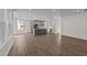 Spacious living room with hardwood floors and kitchen view at 34 Windflower Ct, Clayton, NC 27520