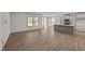 Open living room with hardwood floors and kitchen view at 34 Windflower Ct, Clayton, NC 27520