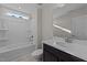 Bathroom with tub, toilet, vanity, and mirror at 36 Railcar Way, Clayton, NC 27520
