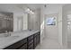 Double vanity bathroom with a large mirror and shower at 36 Railcar Way, Clayton, NC 27520