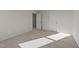 Spacious bedroom featuring carpet and access to another room at 36 Railcar Way, Clayton, NC 27520