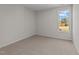 Bright bedroom with carpeted floor and a window offering natural light at 36 Railcar Way, Clayton, NC 27520