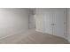 Spacious bedroom with carpeted floor and double door closet at 36 Railcar Way, Clayton, NC 27520