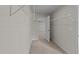 Walk-in closet with wire shelving and neutral carpeting at 36 Railcar Way, Clayton, NC 27520