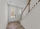 Bright entryway with hardwood floors and a staircase at 36 Railcar Way, Clayton, NC 27520