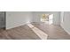 Gathering room features hardwood floors and access to a back patio at 36 Railcar Way, Clayton, NC 27520