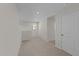 Bright hallway with carpet, access to rooms and a window at 36 Railcar Way, Clayton, NC 27520