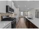 Modern kitchen with island and stainless steel appliances at 36 Railcar Way, Clayton, NC 27520