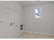 Laundry room with shelving, hookups and window at 36 Railcar Way, Clayton, NC 27520