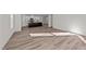 Open living room with kitchen view and hardwood floors at 36 Railcar Way, Clayton, NC 27520