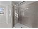 Modern glass shower with neutral tile surround at 36 Railcar Way, Clayton, NC 27520