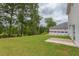 Large backyard, partially covered patio, and treeline at 37 Baird Cv Ln, Angier, NC 27501