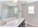 Modern bathroom with double vanity and large mirror at 37 Baird Cv Ln, Angier, NC 27501
