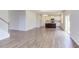 Kitchen with an island, white cabinets, and hardwood floors at 37 Baird Cv Ln, Angier, NC 27501